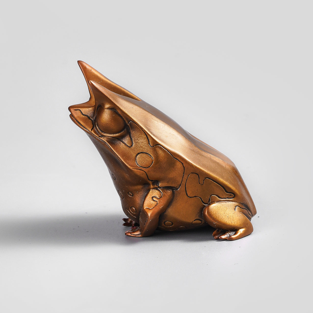 Horned leaf frog figurine