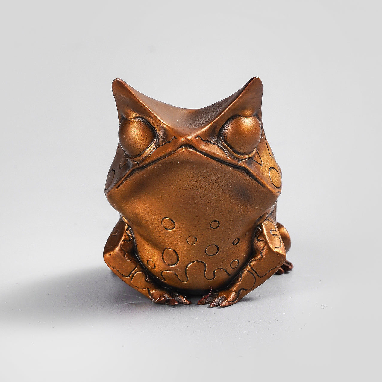 Horned leaf frog figurine