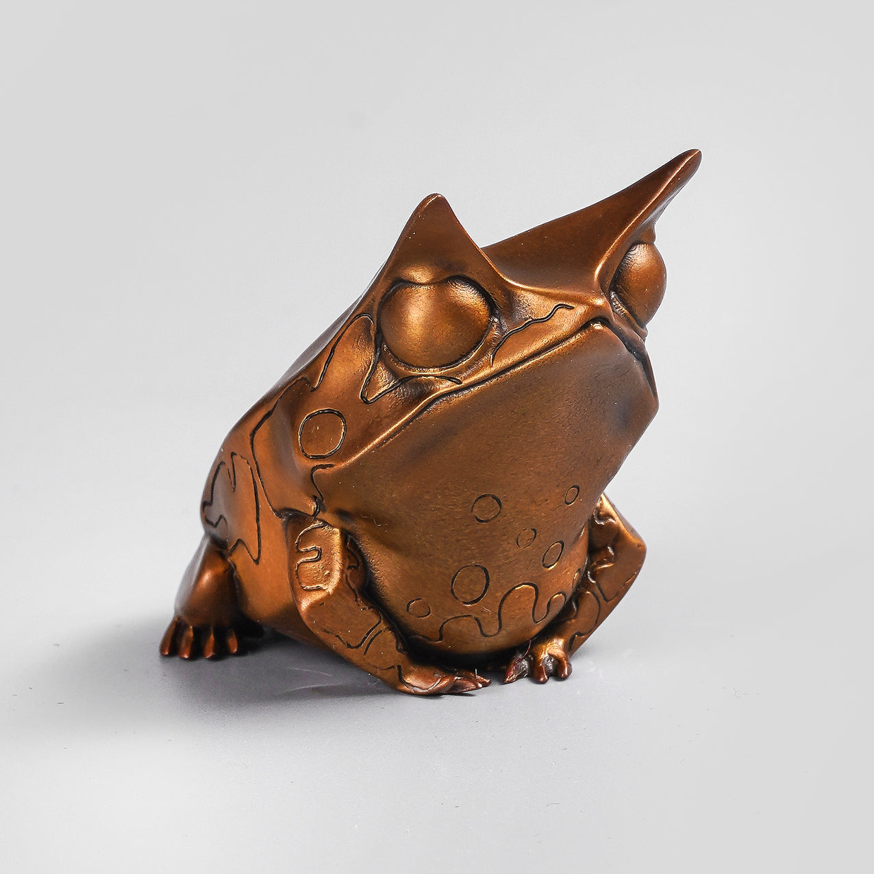 Horned leaf frog figurine